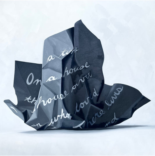 Textured black fabric with white text on a light gray background