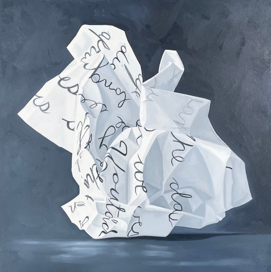 Abstract art piece with crumpled paper and handwritten text on a dark background
